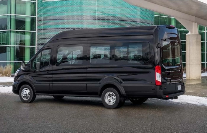 Black 14 passenger van.