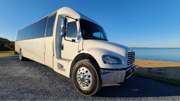 Large white shuttle bus.